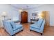 Inviting living room with hardwood floors, comfortable seating, and bright natural light at 5770 Sw 89Th Pl, Ocala, FL 34476