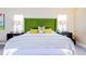Well-lit main bedroom with modern decor and bright pillows at 5770 Sw 89Th Pl, Ocala, FL 34476