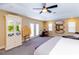 Bright main bedroom with doors to the exterior and a spacious layout at 5770 Sw 89Th Pl, Ocala, FL 34476