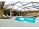Screened-in outdoor pool with patio furniture at 5770 Sw 89Th Pl, Ocala, FL 34476