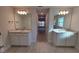 Bathroom with double vanities, granite countertops and recessed lighting at 6104 Sw 147Th Street Rd, Ocala, FL 34473