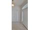 Bright and airy foyer with neutral tile flooring, a front door with side light, and a modern light fixture at 6104 Sw 147Th Street Rd, Ocala, FL 34473