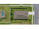 Birds eye view of backyard fenced in lawn with mature trees next to a pool with screened enclosure at 6437 Sw 45Th Ave, Ocala, FL 34474