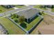 Aerial view of a fenced backyard, featuring a well-manicured lawn and outdoor seating area with mature trees at 6437 Sw 45Th Ave, Ocala, FL 34474