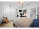 Bedroom featuring a ceiling fan, closet, desk, and workstation at 6437 Sw 45Th Ave, Ocala, FL 34474