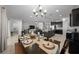 Open concept shows dining room with classic table set that connects to the kitchen and living room at 6437 Sw 45Th Ave, Ocala, FL 34474