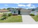Charming one-story home boasts a well-manicured lawn and inviting two-car garage with neutral paint scheme at 6437 Sw 45Th Ave, Ocala, FL 34474