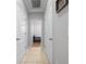 Hallway featuring tile flooring leading into a bedroom at 6437 Sw 45Th Ave, Ocala, FL 34474
