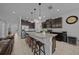 Spacious open kitchen with granite countertops, seating at the island, stainless steel appliances, and ample cabinet space at 6437 Sw 45Th Ave, Ocala, FL 34474