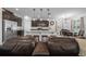 Bright kitchen with stainless steel appliances, an island with seating, flowing seamlessly to the dining and living areas at 6437 Sw 45Th Ave, Ocala, FL 34474