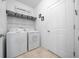 Functional laundry room with washer, dryer, and storage at 6437 Sw 45Th Ave, Ocala, FL 34474
