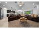 Open-concept living room showcases stylish furnishings, neutral area rug, and natural light at 6437 Sw 45Th Ave, Ocala, FL 34474