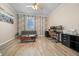 Home office with hardwood-style floors, neutral walls, and lots of sunlight at 6437 Sw 45Th Ave, Ocala, FL 34474