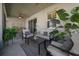 Cozy outdoor patio area with comfortable seating and lush potted plants at 6437 Sw 45Th Ave, Ocala, FL 34474