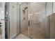 Modern shower with tiled walls, glass doors, and updated fixtures at 6437 Sw 45Th Ave, Ocala, FL 34474