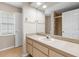 Bathroom boasts a large vanity, mirror, and walk-in shower at 802 Se 50Th Ter, Ocala, FL 34471