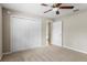 Bedroom showcases a closet and doorway to a bathroom at 802 Se 50Th Ter, Ocala, FL 34471