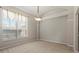 Bright bedroom with large window and neutral carpeting; perfect for relaxation at 802 Se 50Th Ter, Ocala, FL 34471