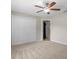 Neutral bedroom offers a ceiling fan and a double door closet at 802 Se 50Th Ter, Ocala, FL 34471
