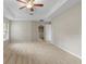 Comfortable bedroom featuring plush carpeting, a ceiling fan, and a well-lit view from the window at 802 Se 50Th Ter, Ocala, FL 34471