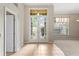 Bright foyer with tile flooring, French doors, and a view to the front yard at 802 Se 50Th Ter, Ocala, FL 34471