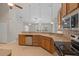 Kitchen featuring light wood cabinetry, a stainless-steel dishwasher, and a breakfast bar at 802 Se 50Th Ter, Ocala, FL 34471