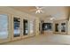 Covered patio includes three ceiling fans and multiple access doors at 802 Se 50Th Ter, Ocala, FL 34471