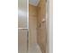 Beautifully tiled shower with a brushed metal shower head at 802 Se 50Th Ter, Ocala, FL 34471