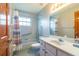 En-suite bathroom with shower/tub combo, grab bars, and vanity sink at 828 Ne 51St Ave, Ocala, FL 34470
