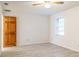 Bedroom with ceiling fan, window, and door at 828 Ne 51St Ave, Ocala, FL 34470