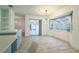 Light filled dining area featuring a large bay window and sliding glass doors at 828 Ne 51St Ave, Ocala, FL 34470