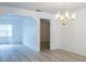 Bright dining room with views into two other rooms and a chandelier at 828 Ne 51St Ave, Ocala, FL 34470