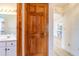 Hallway view of bathroom and access to kitchen/living room area at 828 Ne 51St Ave, Ocala, FL 34470