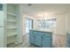 Open kitchen and dining area with an island and sliding glass doors at 828 Ne 51St Ave, Ocala, FL 34470