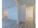 View of large open living space with gray wood-look floors, open design and white walls at 828 Ne 51St Ave, Ocala, FL 34470