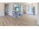 Bar seating between kitchen and bright living room with access to dining area at 828 Ne 51St Ave, Ocala, FL 34470