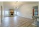 Spacious living room features stone fireplace, bar seating, wood floors and modern light at 828 Ne 51St Ave, Ocala, FL 34470