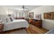 Comfortable bedroom with hardwood floors, soft natural light, and tastefully decorated furnishings at 8712 Sw 92Nd Pl # D, Ocala, FL 34481
