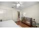 Bedroom featuring a closet, mirrored dresser and ceiling fan at 8712 Sw 92Nd Pl # D, Ocala, FL 34481