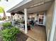 Inviting front porch with a 'Welcome To Our Porch' sign, complemented by outdoor seating and lush greenery at 8712 Sw 92Nd Pl # D, Ocala, FL 34481