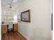 Bright office with a ceiling fan, wood floors, and a built-in desk and storage at 8712 Sw 92Nd Pl # D, Ocala, FL 34481