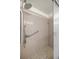 Walk-in shower with grab bars and patterned floor tiles at 8712 Sw 92Nd Pl # D, Ocala, FL 34481