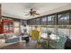 Cozy sunroom featuring a dining table, large windows, and comfortable seating at 8712 Sw 92Nd Pl # D, Ocala, FL 34481