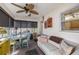 Cozy sunroom featuring a ceiling fan, large windows, and comfortable seating at 8712 Sw 92Nd Pl # D, Ocala, FL 34481