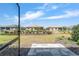 View of the backyard from the lanai, showcasing the pavers, lawn, and landscaping at 8820 Sw 104Th Cir, Ocala, FL 34481
