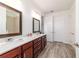 Bathroom featuring a walk-in shower and double sink vanity at 8820 Sw 104Th Cir, Ocala, FL 34481