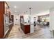 This kitchen features stainless steel appliances, a spacious center island, and dark wood cabinetry at 8820 Sw 104Th Cir, Ocala, FL 34481