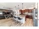 This kitchen features stainless steel appliances, granite countertops, and a large center island at 8820 Sw 104Th Cir, Ocala, FL 34481