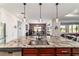 This kitchen features stainless steel appliances, granite countertops, and a large center island at 8820 Sw 104Th Cir, Ocala, FL 34481