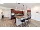 This kitchen features stainless steel appliances, granite countertops, and a large center island with seating at 8820 Sw 104Th Cir, Ocala, FL 34481